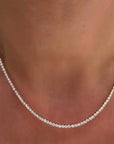 Model wearing lab created diamond tennis necklace | Camille Jewelry