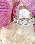 Sterling silver curb ring with pave in cubic zirconia stones in on a flower and quartz stone display video by Camille Jewelry