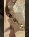 Video of Mariner Bracelet in 14K yellow gold with 1 CTW lab-grown diamonds, mariner link fine jewelry design by Camille Jewelry, showing sparkle and movement.
