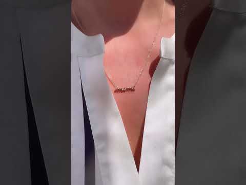 Video of Model wearing script mimi necklace on a delicate chain in yellow gold | Camille Jewelry