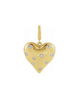 A yellow gold puffy heart charm decorated with natural diamond stones, shown on a plain white background,Camille Jewelry.
