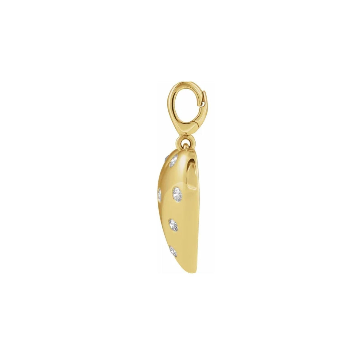 A 14k yellow gold puffy heart charm side view with small natural diamonds set along its side, suspended from a gold lobster clasp, shown on a plain white background, Camille Jewelry.
