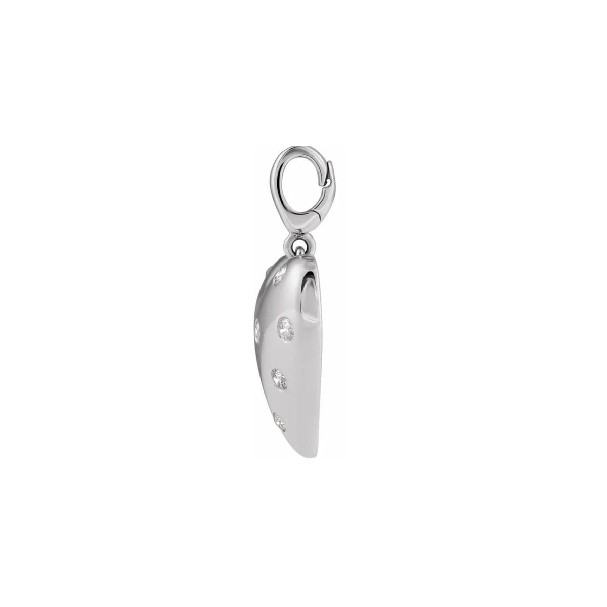 A 14k white gold puffy heart charm side view with small natural diamonds set along its side, suspended from a gold lobster clasp, shown on a plain white background, Camille Jewelry.