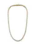 Modern tennis necklace in gold plated sterling silver with cubic zirconia on a white background by Camille Jewelry