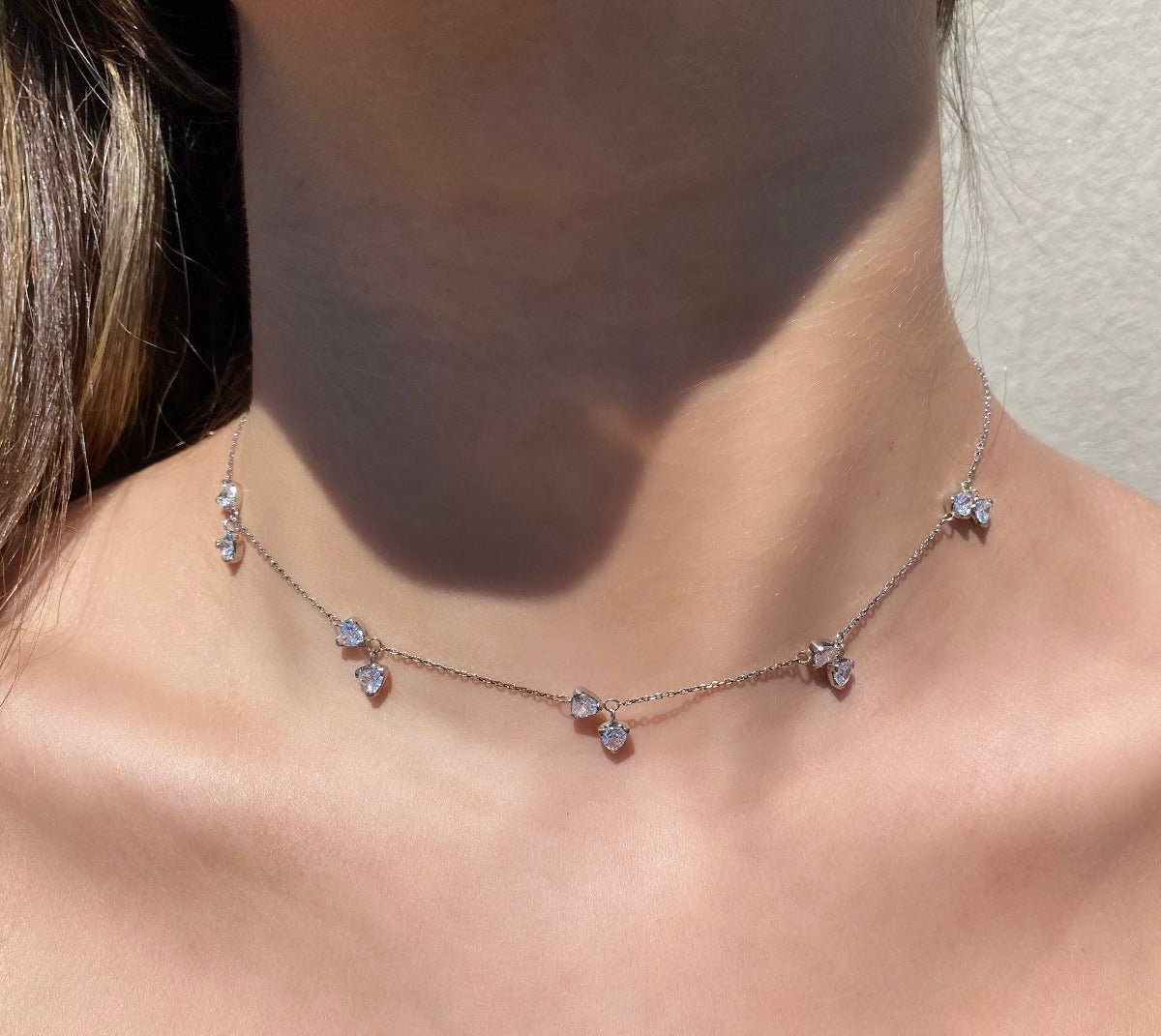Model wearing Sterling Silver Charm Necklace on a models neck- Camille Jewelry