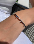 Trillion Cuff Bracelet – Edgy Bangle in Gold Vermeil on models wrist- Camille Jewelry