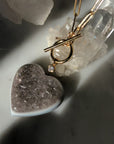 Quartz heart druzy pendant on 14K gold filled paperclip chain with toggle front closure at Camille Jewelry.